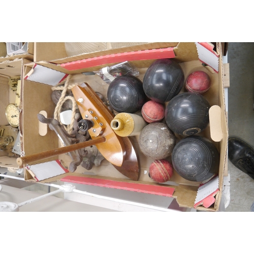 2045 - A box of lawn bowls and a boat lamp
