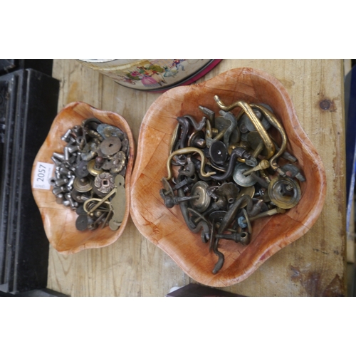 2057 - Two tubs of Georgian brass handles and later fixings
