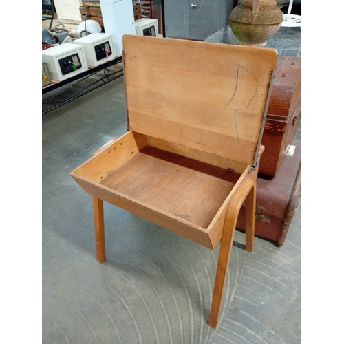 2010A - A mid 20th Century child's oak lift top desk on beech bent ply legs
