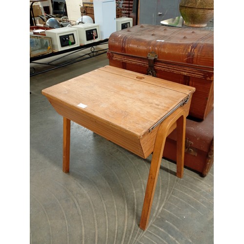 2010A - A mid 20th Century child's oak lift top desk on beech bent ply legs