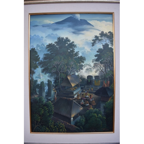 5037 - WUDNATA 2005 Contemporary making offerings to the gods, Bali temple in jungle with volcano to backgr... 
