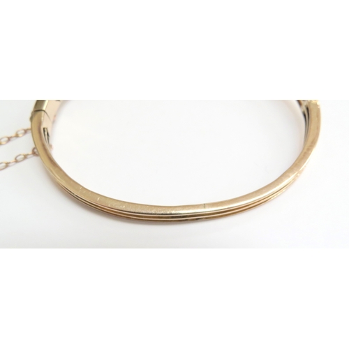 7059 - A diamond set hinged bangle with 35 various sized rose cut diamonds, unmarked, 6cm x 5cm, 16g