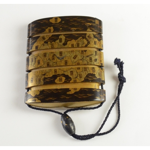 9009 - A gold lacquer five case inro depicting a map of Japan

6.8cm high, 6.8cm wide

Provenance
Henry Pot... 