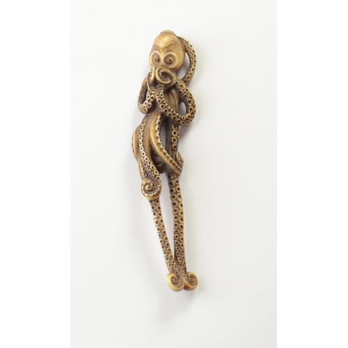 9039 - A tall ivory netsuke of an anthropomorphic octopus standing on two tentacles, posed as though human ... 