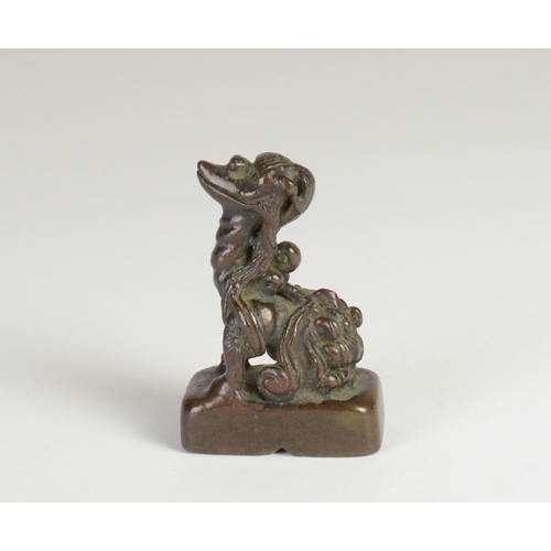 9032 - A Chinese bronze seal in the form of a mythical creature

5cm high, 3.2cm wide and 2cm deep

Provena... 