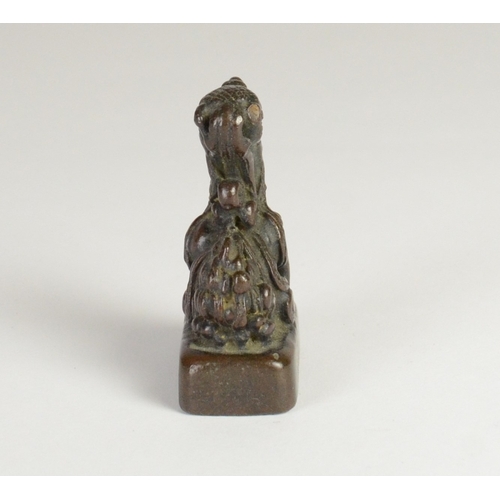 9032 - A Chinese bronze seal in the form of a mythical creature

5cm high, 3.2cm wide and 2cm deep

Provena... 