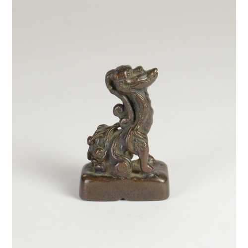 9032 - A Chinese bronze seal in the form of a mythical creature

5cm high, 3.2cm wide and 2cm deep

Provena... 