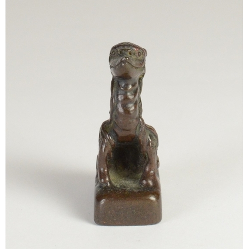 9032 - A Chinese bronze seal in the form of a mythical creature

5cm high, 3.2cm wide and 2cm deep

Provena... 