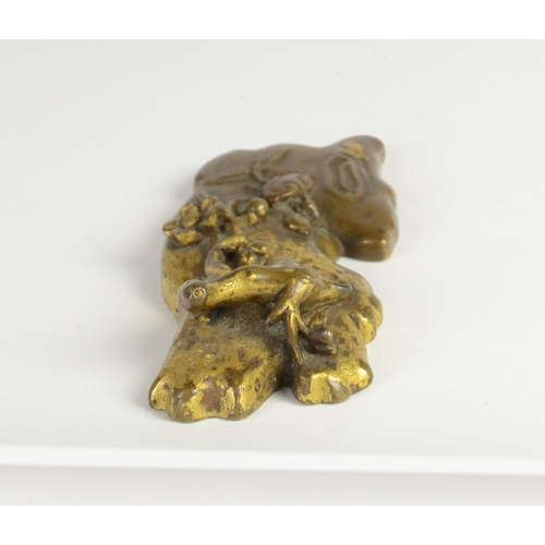 9026 - A Chinese bronze scroll weight in the form of blossoming branches and bamboo, Qianlong four characte... 