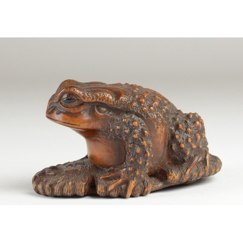 9061 - MASANAO: a wooden netsuke in the form of a toad on a broken waraji (sandal), signed to base
2.5cm hi... 