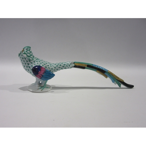 1252 - A Herend hand painted porcelain figurine of a green fishnet pheasant, model 5025, approximately 22cm... 