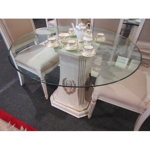 1087 - A French reproduction breakfast table, cream and gilt base with ribbon and swag design, circular gla... 