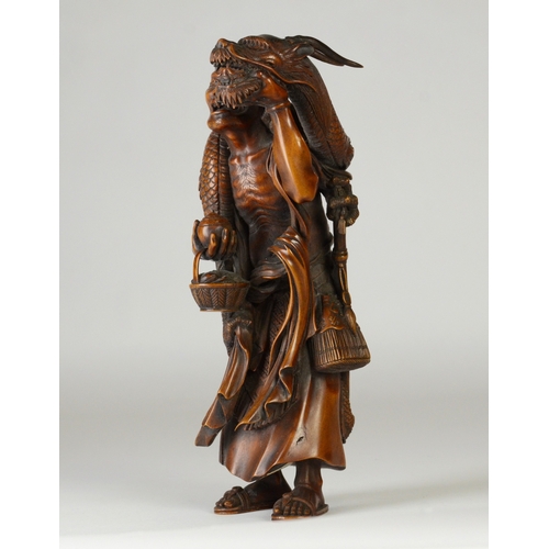 9001 - A large Japanese wooden okimono figure of Handaka Sonja with dragon coiled around his body and over ... 