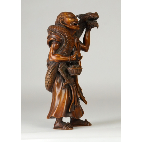 9001 - A large Japanese wooden okimono figure of Handaka Sonja with dragon coiled around his body and over ... 