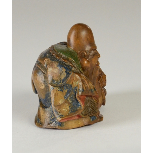 9051 - SHUZAN a wooden and partially lacquered netsuke depicting Fukurokuju with Hotei in his bag, signed t... 