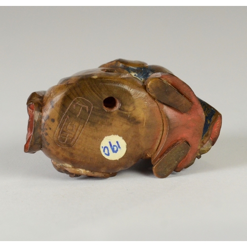 9051 - SHUZAN a wooden and partially lacquered netsuke depicting Fukurokuju with Hotei in his bag, signed t... 