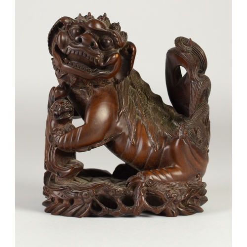 9002 - A carved wooden figure of a shishi and pup, unsigned

10cm high

Provenance
Henry Potter & Dorothy A... 