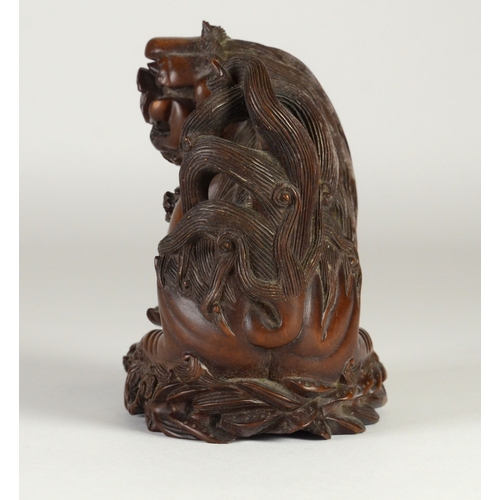 9002 - A carved wooden figure of a shishi and pup, unsigned

10cm high

Provenance
Henry Potter & Dorothy A... 