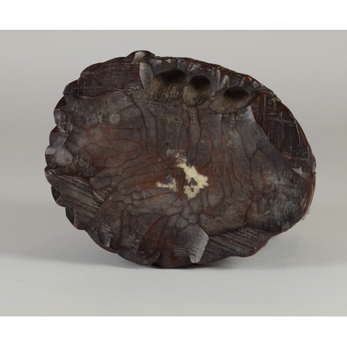 9002 - A carved wooden figure of a shishi and pup, unsigned

10cm high

Provenance
Henry Potter & Dorothy A... 