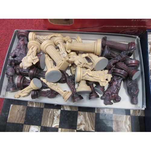 8023 - A collection of chess sets with wooden and onyx boards