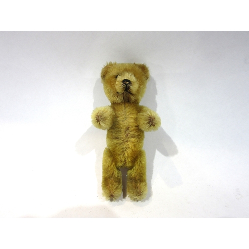 8053 - An early 20th Century Schuco golden mohair jointed Teddy Bear scent bottle, head removing to reveal ... 