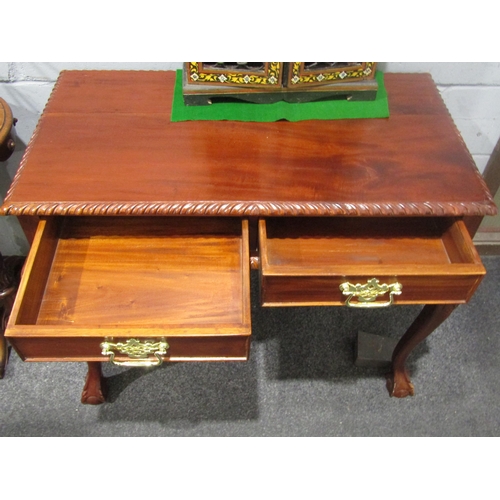1035 - A reproduction mahogany two drawer side table on cabriole legs on ball and claw feet, 75cm tall x 98... 