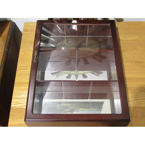 1022 - A Metamec star wall clock and small glazed cabinet (2)