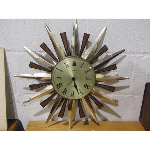 1022 - A Metamec star wall clock and small glazed cabinet (2)