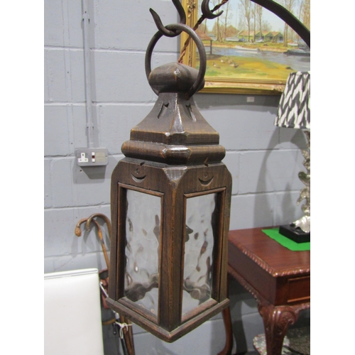 1037 - A lantern form height adjustable oak standard lamp