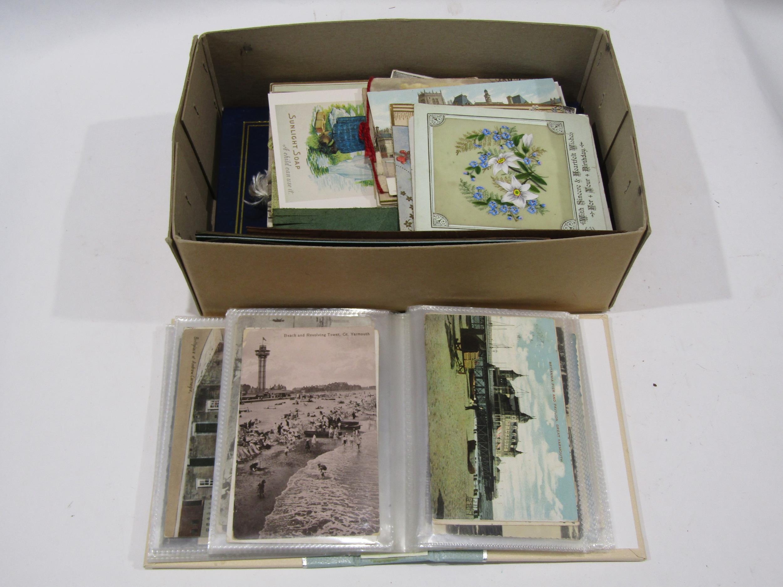A small box containing topographical postcards, greetings cards and ...