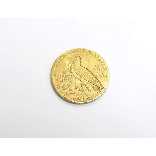 6537 - A gold two and half dollar coin dated 1910 with eagle to one side, native American bust to obverse