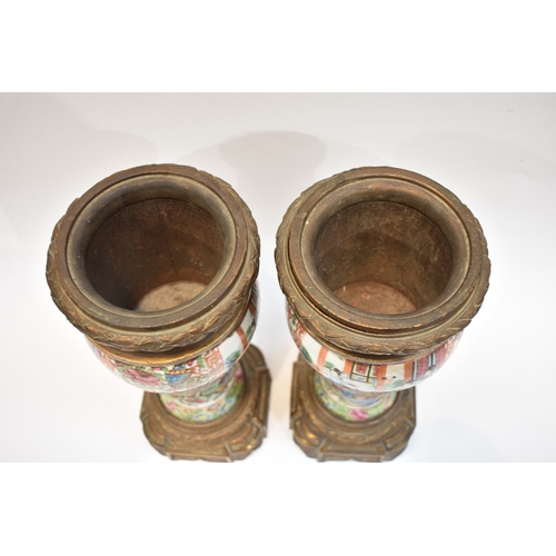 1001 - A pair of early-mid 19th Century Chinese canton vases with ornate ormolu tops and bases. The ceramic... 