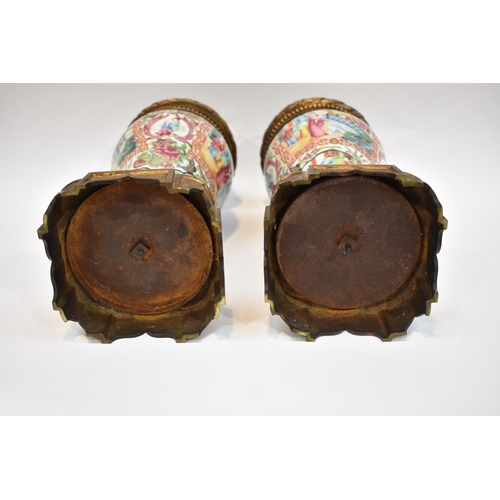 1001 - A pair of early-mid 19th Century Chinese canton vases with ornate ormolu tops and bases. The ceramic... 
