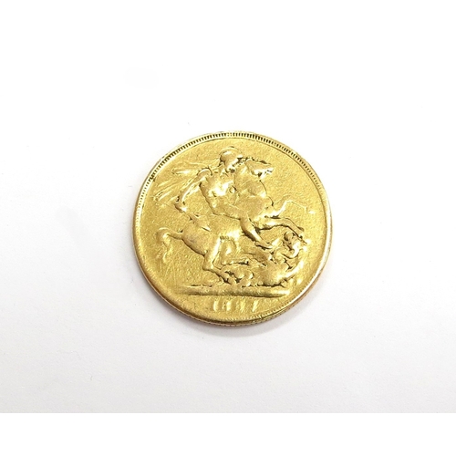 6540 - An 1887 gold sovereign, worn