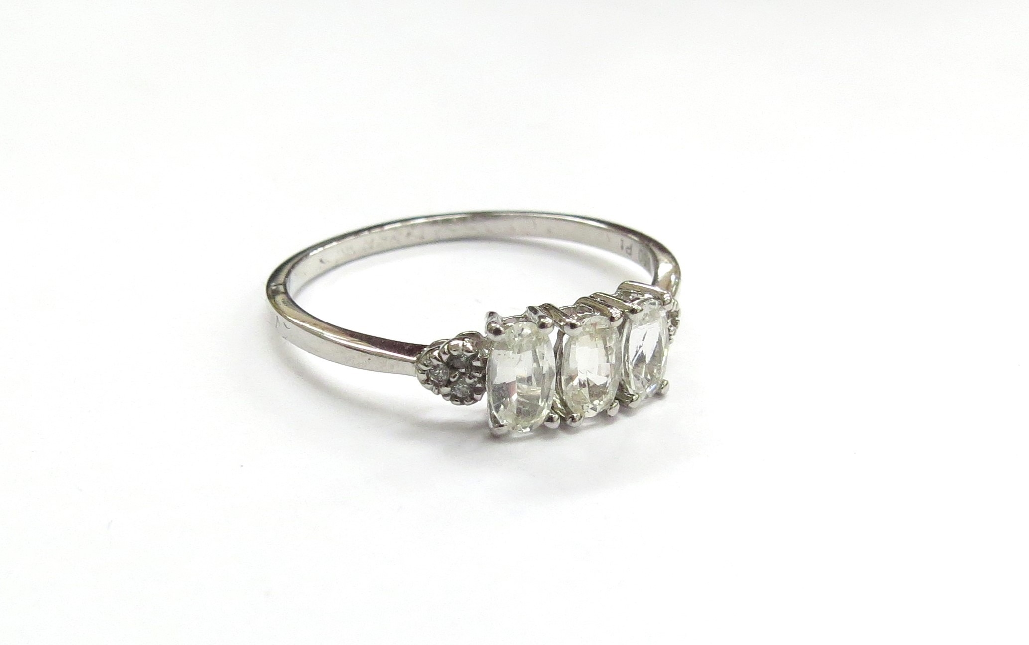 A Tomas Rae platinum Ceylon white sapphire ring. Size P/Q, 2.4g
