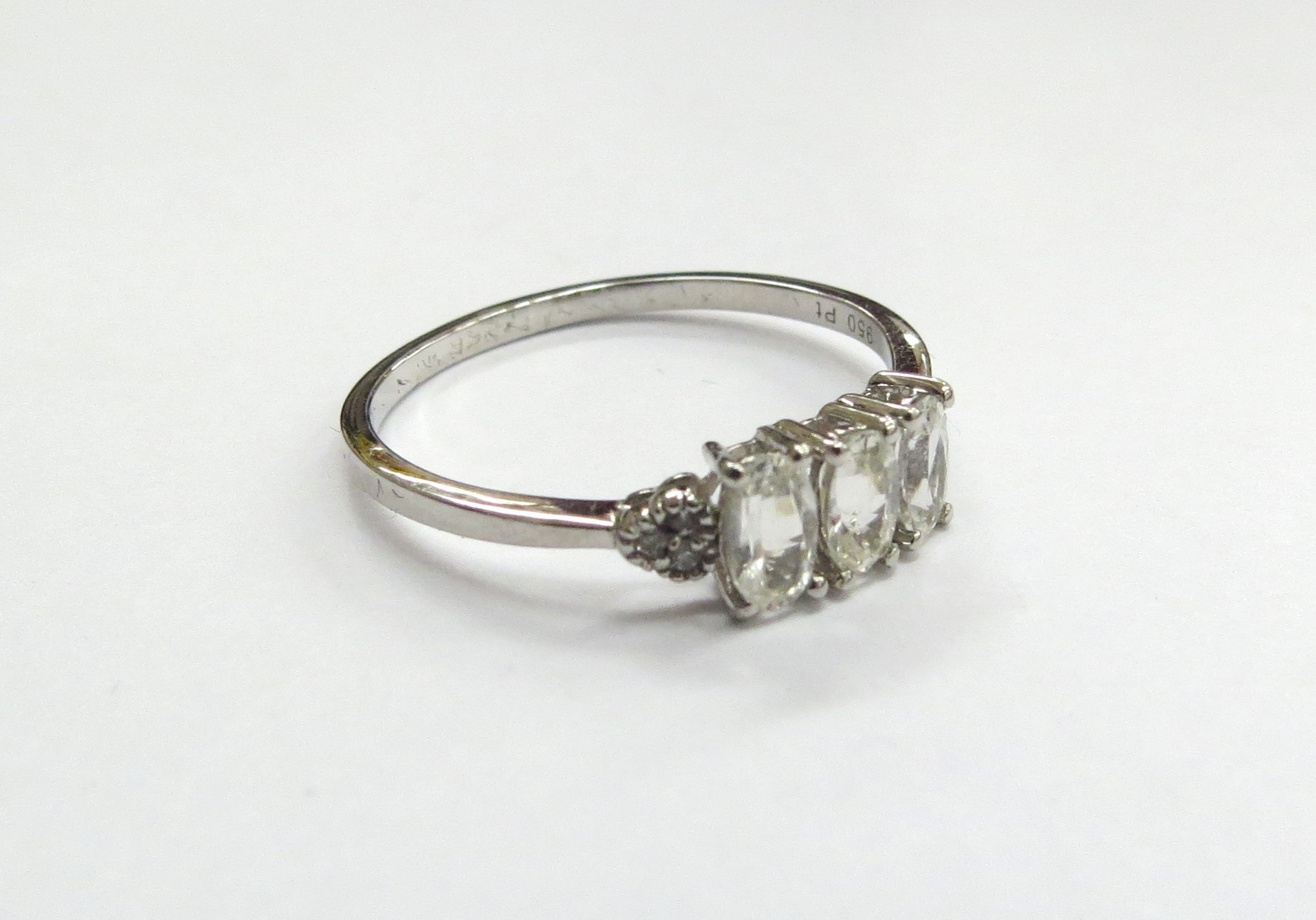 A Tomas Rae platinum Ceylon white sapphire ring. Size P/Q, 2.4g