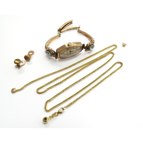 6493 - A pair of gold suds stamped 750, 2.1g an unmarked broken gold chain, 5.5g and a 9ct gold cased wrist... 