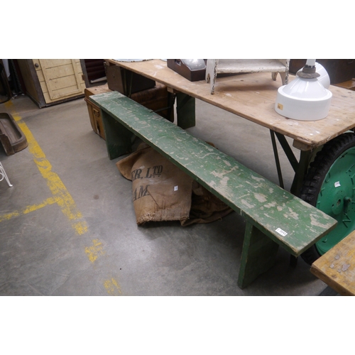 2042 - A rustic green painted pine bench, 190cm long