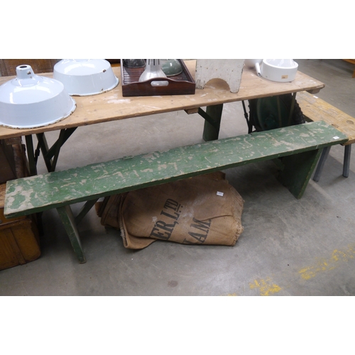 2042 - A rustic green painted pine bench, 190cm long