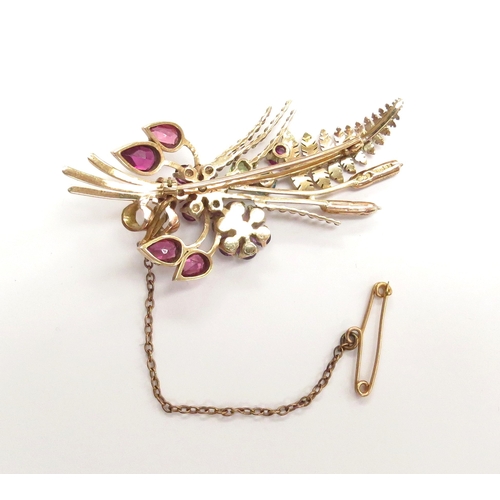 6054 - A 9ct gold brooch as a posy of semi-precious stone set flowers, fern frond and bullrushes, maker's m... 