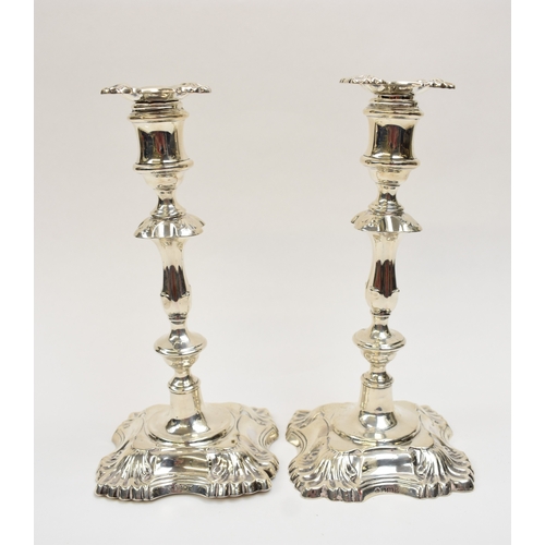 8032 - A pair of William Hutton & Sons Ltd silver candlesticks with weighted bases. Both bases are engraved... 