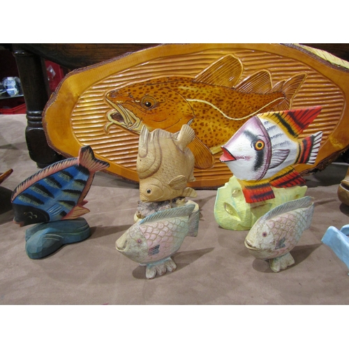 4010 - Seven wooden and one plaster model fish, including carved beta-type fish, and a carved silver birch ... 