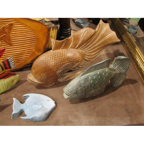 4010 - Seven wooden and one plaster model fish, including carved beta-type fish, and a carved silver birch ... 