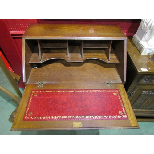 4022 - An oak Old Charm style four drawer bureau, gilt tooled writing surface, 99cm tall x 79cm wide x 48cm... 