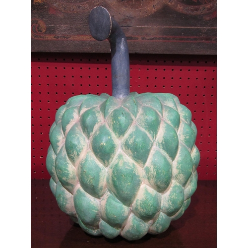 4040 - A painted hardwood exotic fruit, 35cm tall