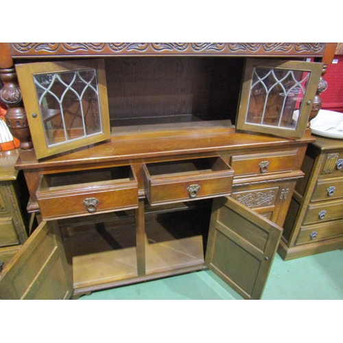 4042 - A 20th Century oak Old Charm style court cupboard, 138cm tall x 137cm wide x 46cm deep