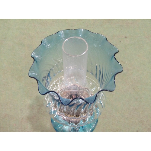 4045 - A 19th Century oil lamp of column form with cast iron base and faux marble column, blue glass reserv... 