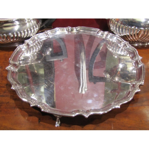 4054 - A silver plated teapot and matching coffee pot together with a plated footed tray (3)