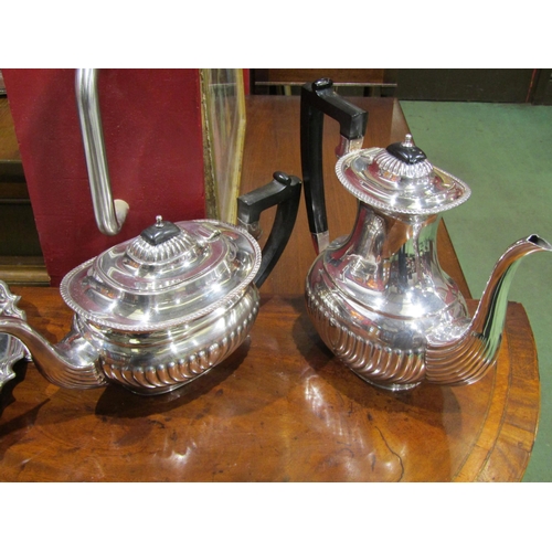 4054 - A silver plated teapot and matching coffee pot together with a plated footed tray (3)
