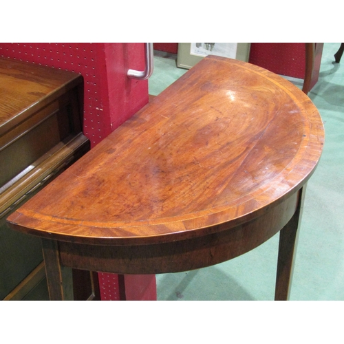 4055 - A 19th Century crossbanded mahogany demi-lune table on square tapering legs with line inlay decorati... 